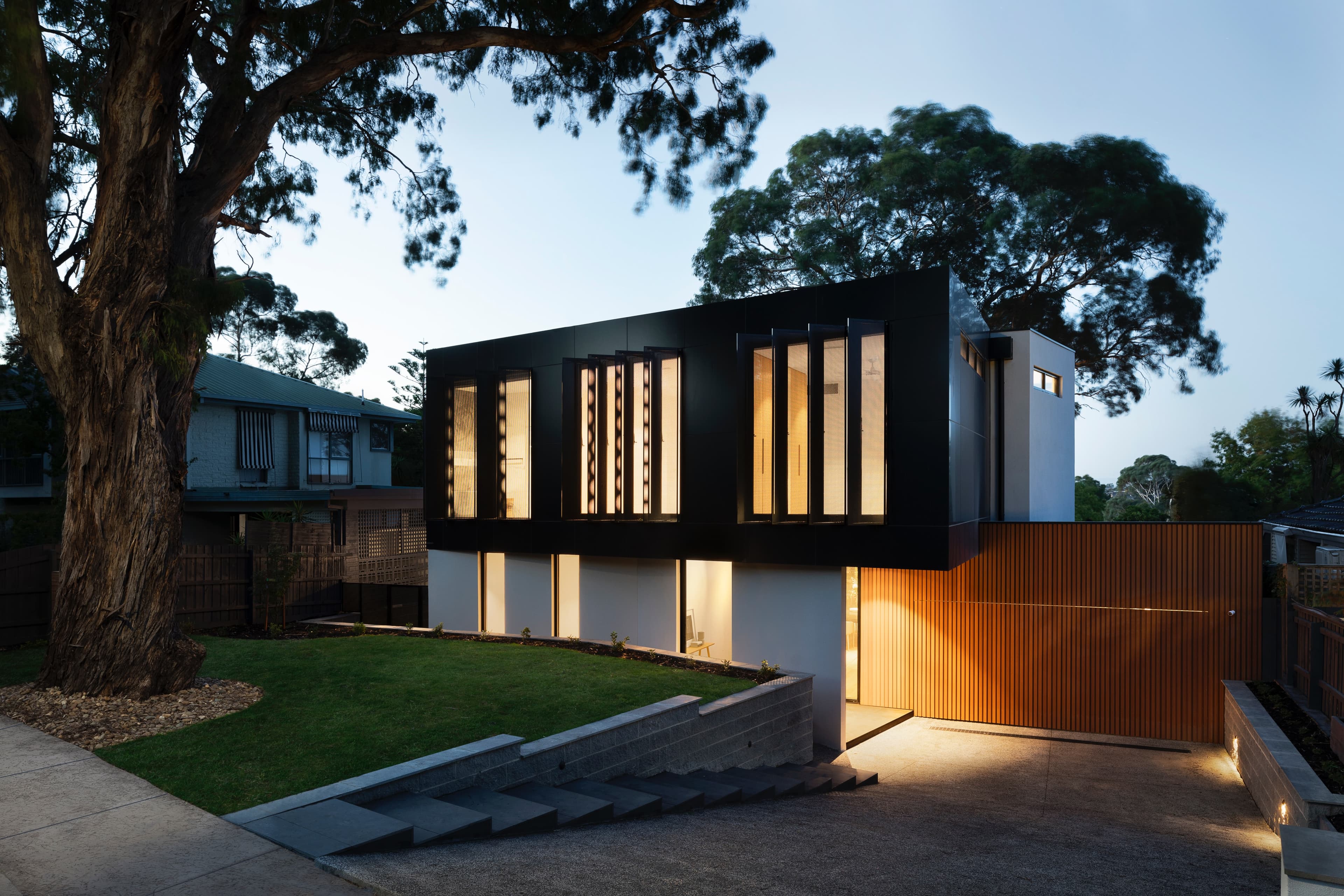 A black Modern Villa with a landscape view